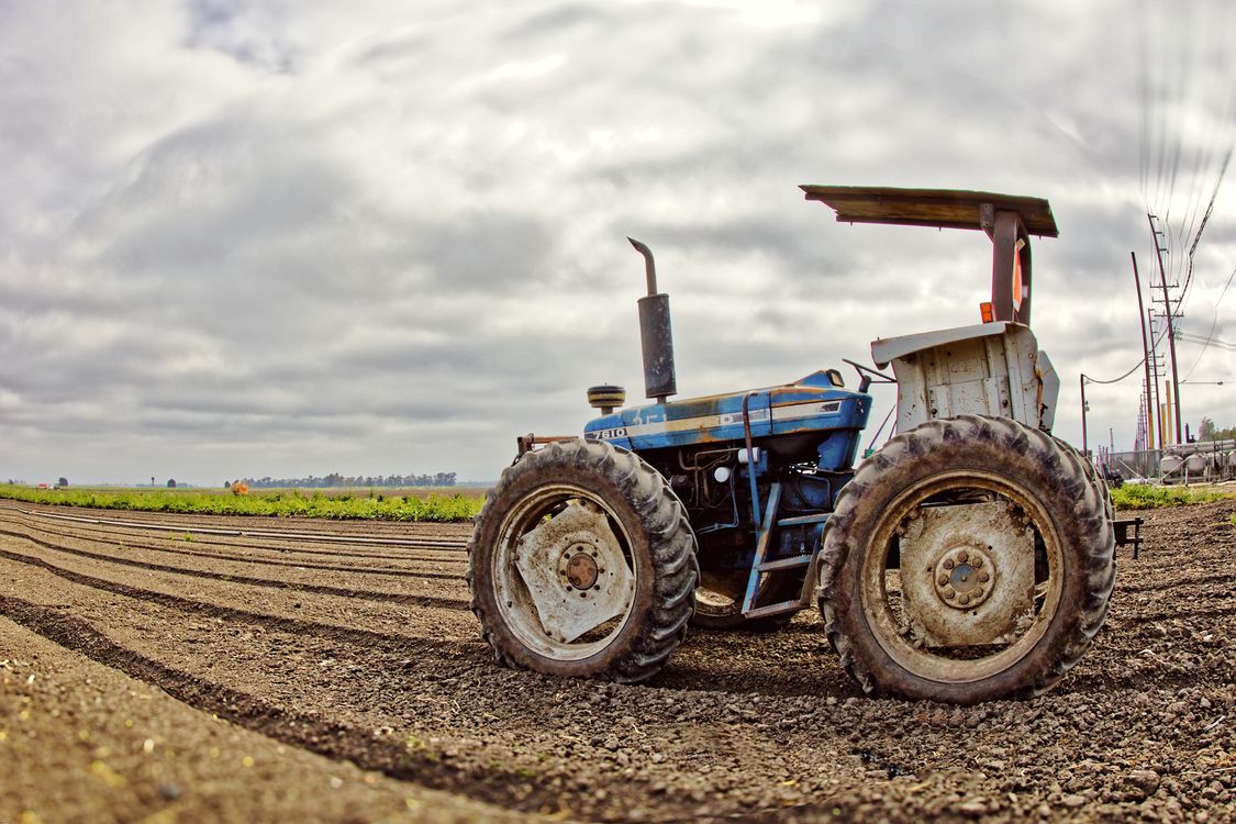 Tractor Images A Tractor in a Field · Free Stock Photo