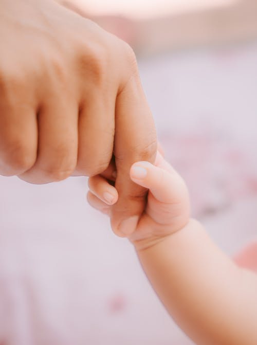 Baby Hand Grabbing Finger