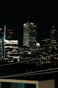 Spectacular nighttime view of modern skyscrapers in Toronto's downtown core.