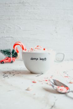 A festive mug with 'choose happy', candy cane, and Christmas decor in Ankara.
