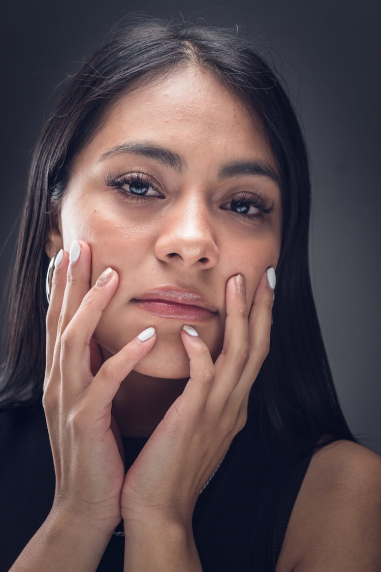 Portrait Of A Woman Touching Her Face