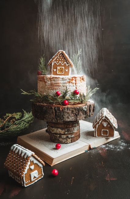 Rustic gingerbread cake adorned with powdered sugar and festive decorations.