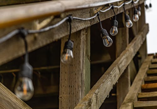 Close-Up Photo of String Light Bulbs Hanging on Wood