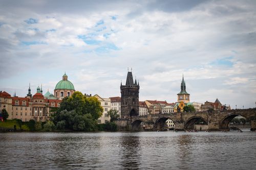 Free Stunning view of Charles Bridge with Prague's historic architecture and Vltava River. Stock Photo