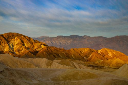 Free Captivating landscape of rock mountains glowing under golden sunset hues, depicting nature's grandeur. Stock Photo