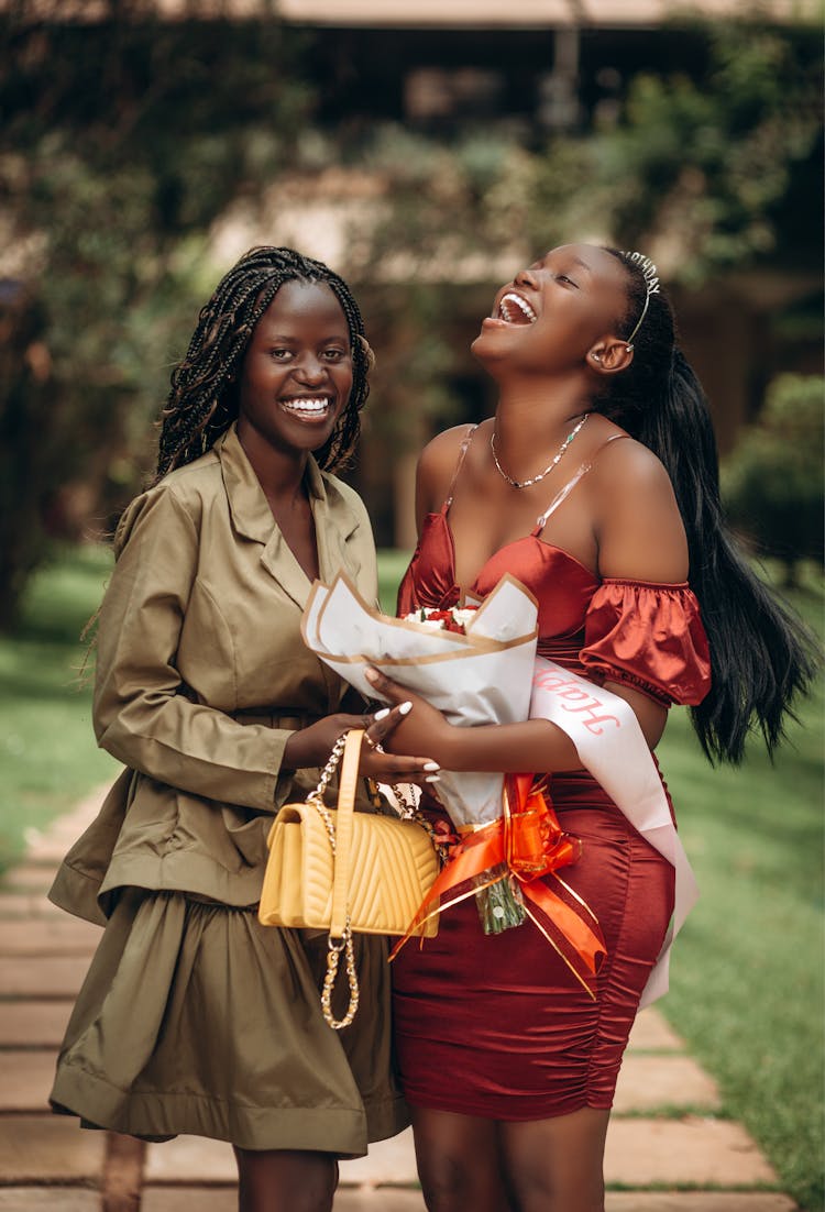 Young Women In Elegant Clothing Laughing