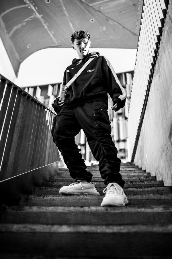 Black and white portrait of a man on a stairway