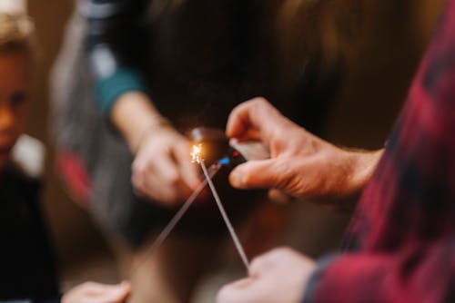 Woman Hands Lighting Sparklers