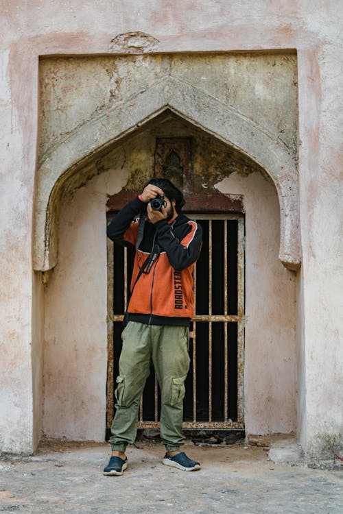 Free A Man in a Jacket Taking a Picture  Stock Photo