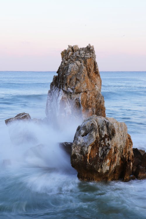 Waves Crashing Against a Rock Formation