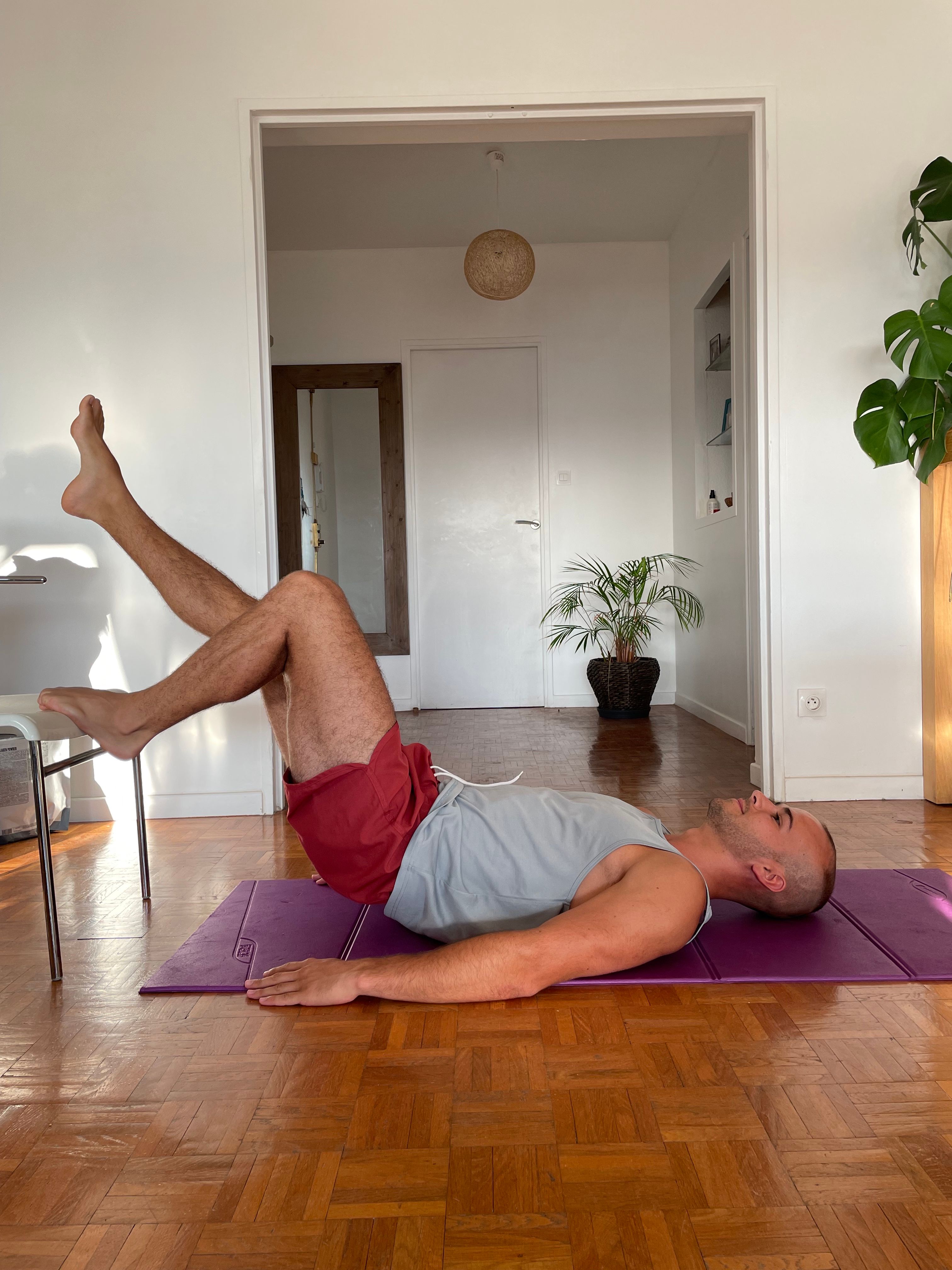 Person sitting and doing seated workouts at home