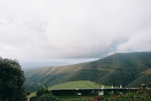 Green Mountain Under Cloudy Sky