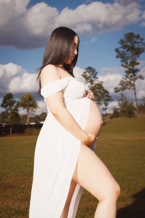 A Pregnant Woman in a White Dress 