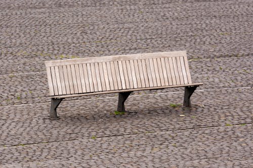 Wooden Bench on Pavement