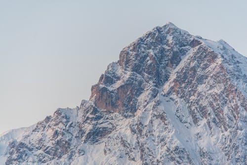 View of a Rocky, Snowcapped Mountain Peak 