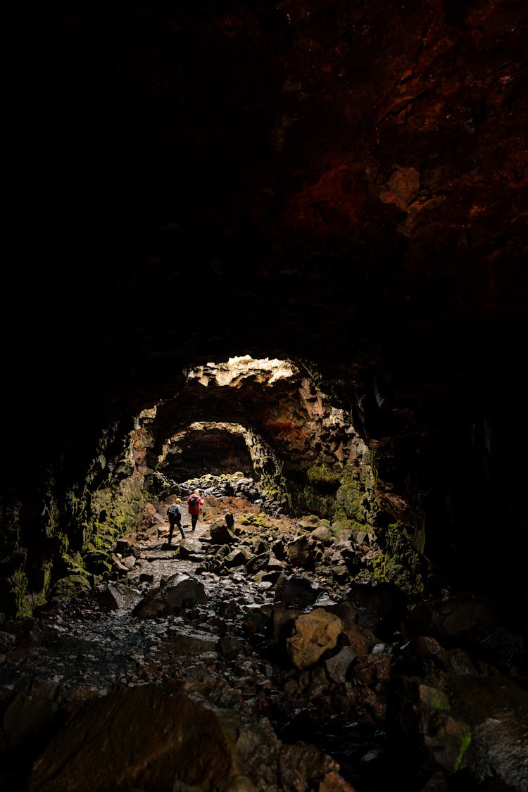 Hikers In Cave