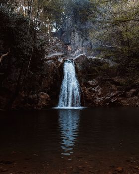 Captivating waterfall cascading in Antalya, surrounded by lush greenery.