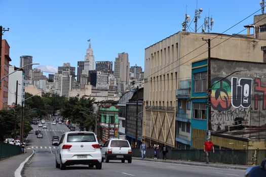 Dynamic cityscape of Sao Paulo featuring urban street and iconic skyline.