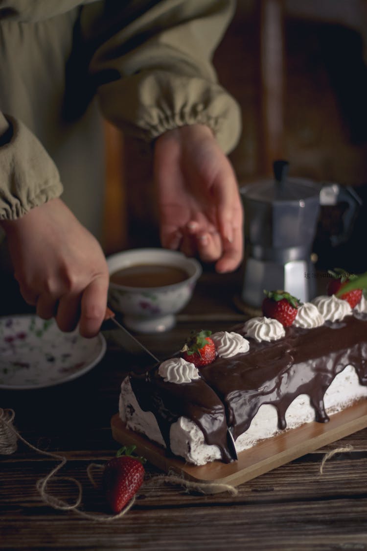 Woman Slicing A Cake 