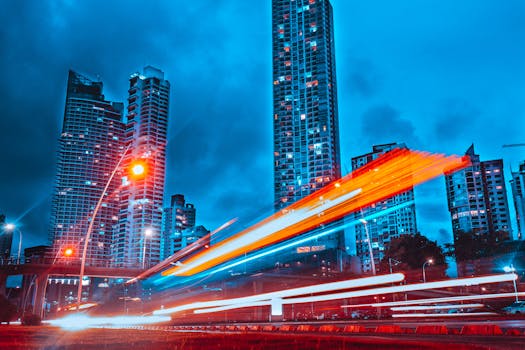 Stunning blue-toned cityscape of Panama City with dynamic light trails at night.