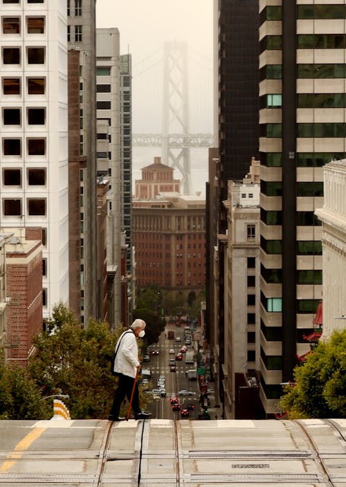 Man Crossing Steep Street in San Francisco