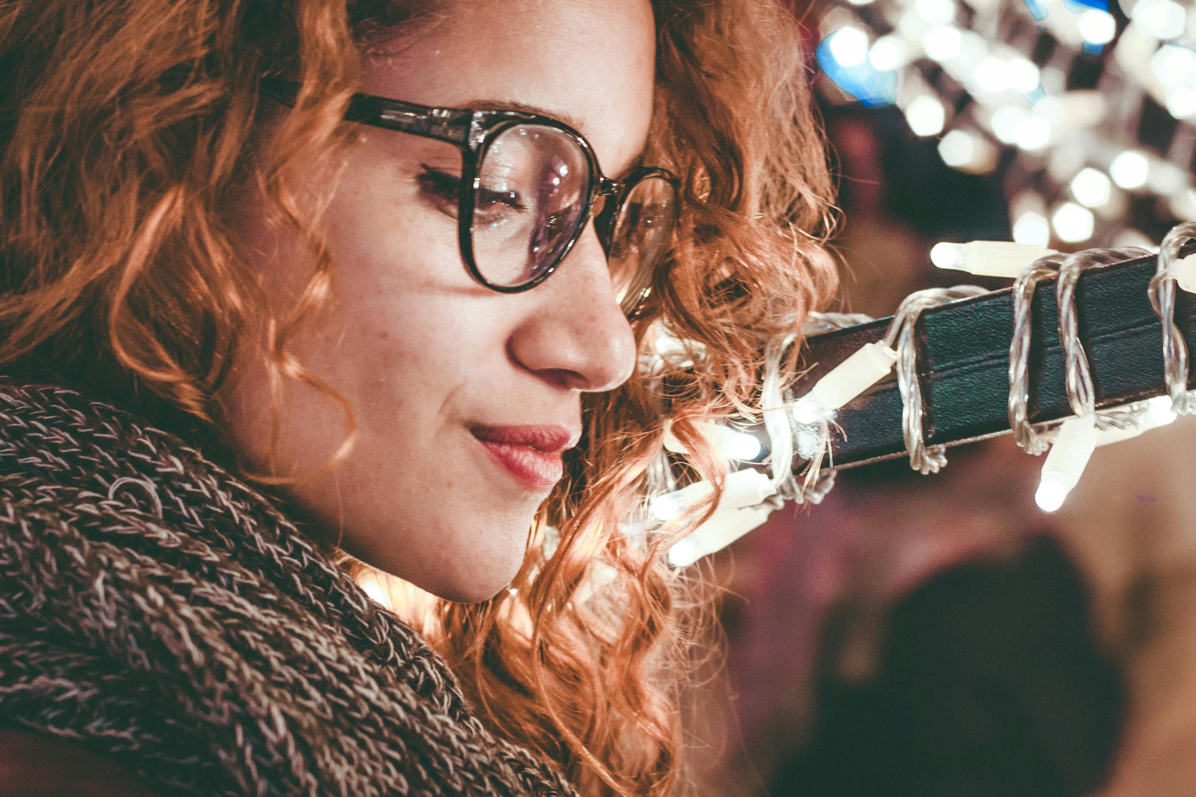 close up photo of a woman wearing eyeglasses