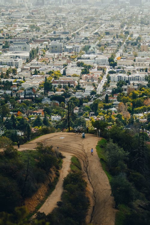 Aerial View of a Hill with a Hiking Trail and View of the City of Los Angeles, California, USA