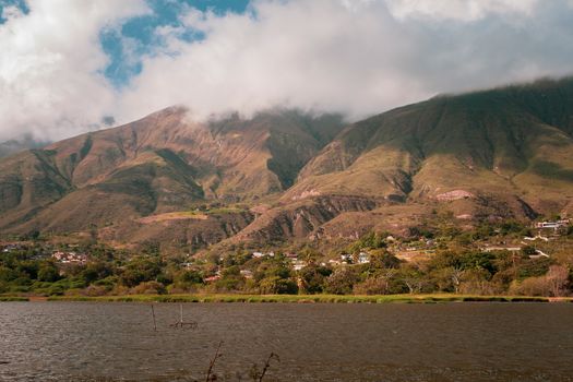 Breathtaking view of Sierra Nevada mountains with a serene lake in Mérida, Venezuela.