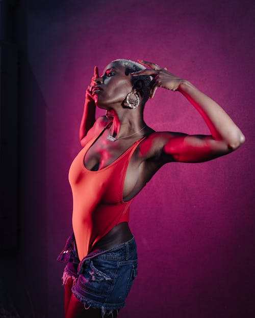 Woman Posing with Arms around Head