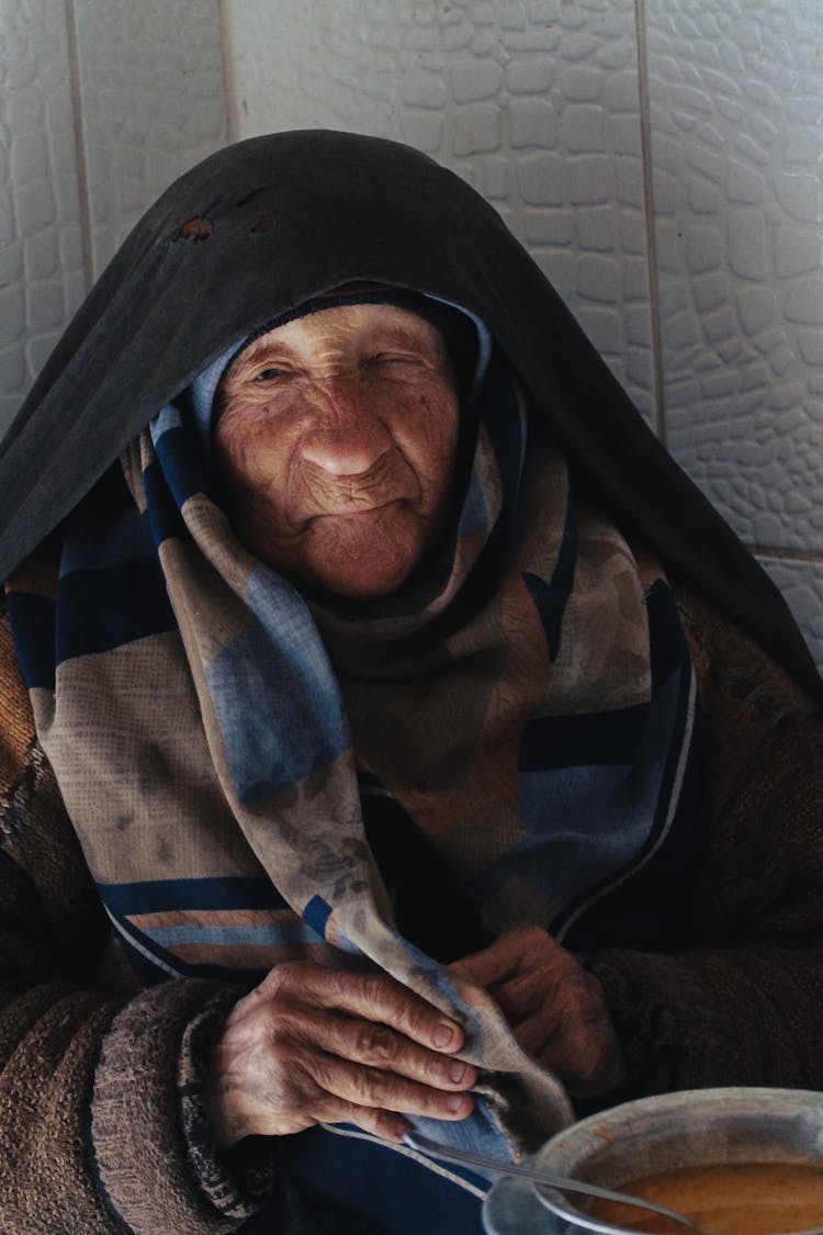 Elderly Woman Eating Soup