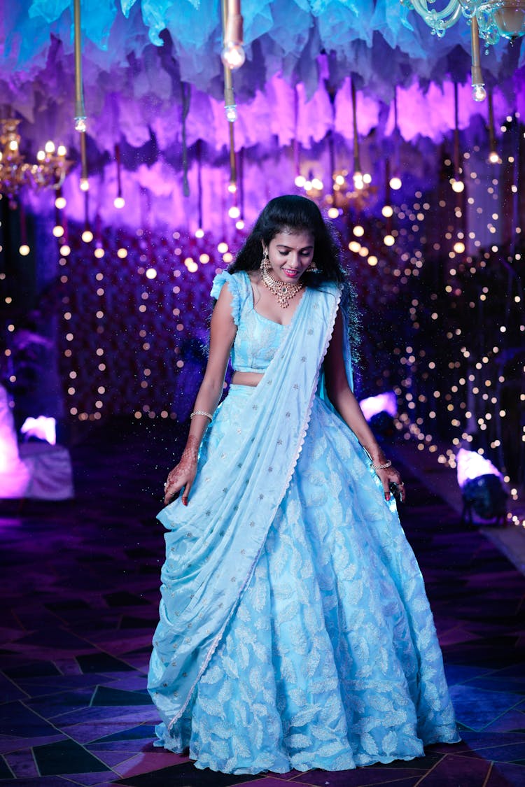 Woman In Light Blue Lehenga Walking On Stage