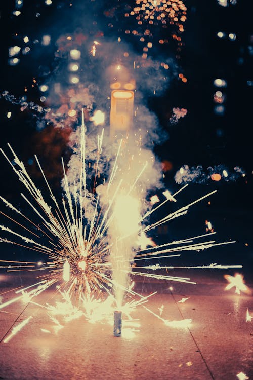 Sparklers on the Ground During Night Time