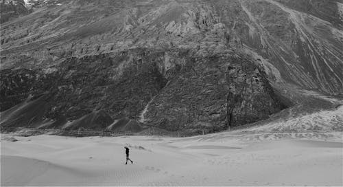 Person Walking on a Desert 