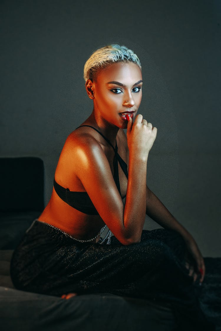 Woman With Dyed Hair Sitting And Posing