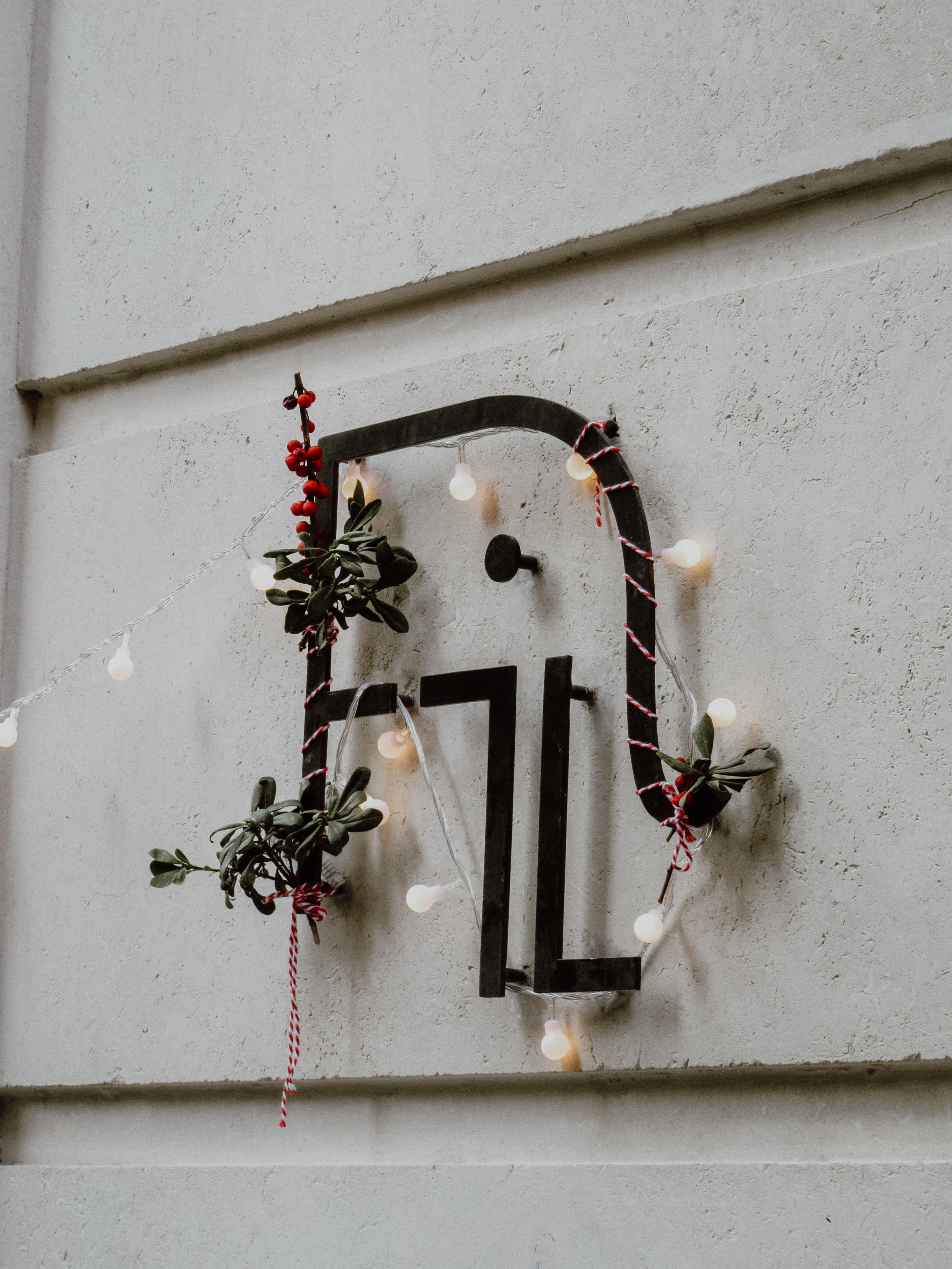 Elegant Christmas decoration on an Istanbul building exterior with festive lights and greenery.