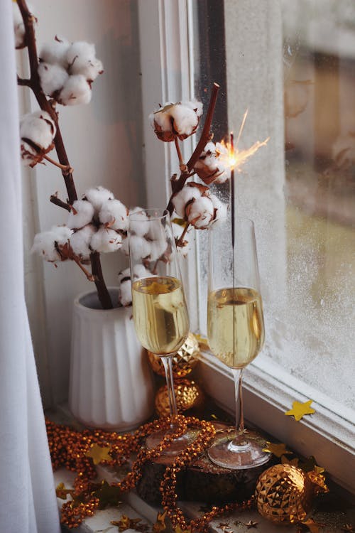 Gold Decorations and Cotton Twigs on a Windowsill