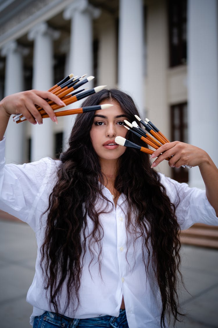 Woman Posing With Brushes