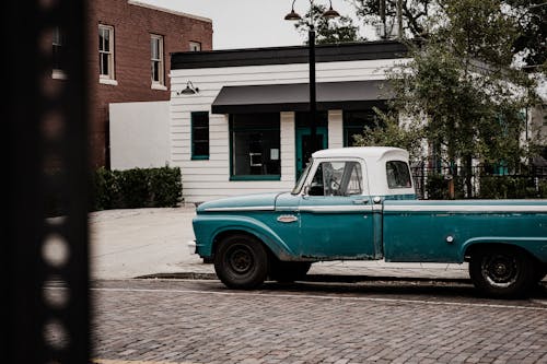 Photo of Blue Classic Pick Up Truck Parked on Roadside