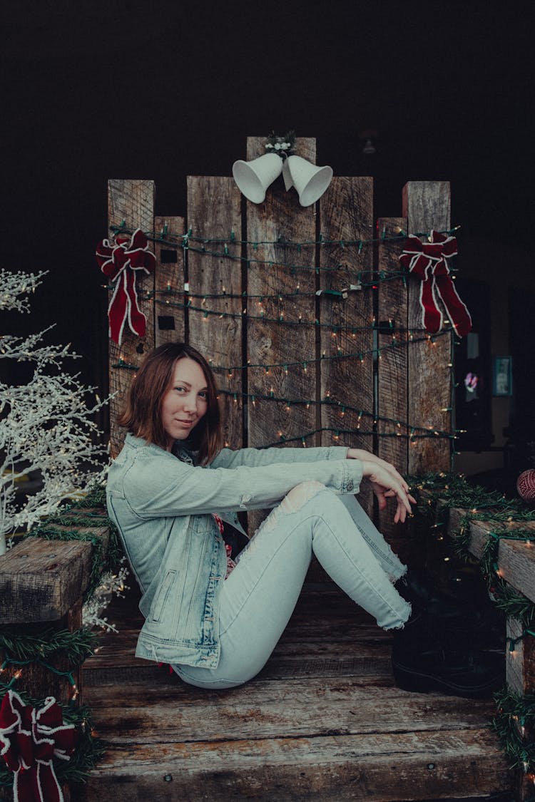 Woman Sitting On A Wooden Throne