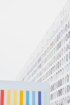 Vertical abstract photo of a modern colorful wall with minimalist patterns.