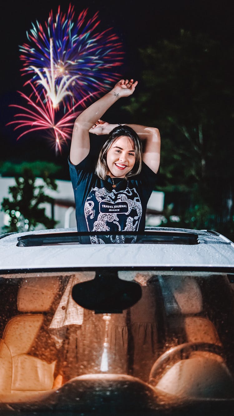 Girl Celebrating New Years Eve In Car