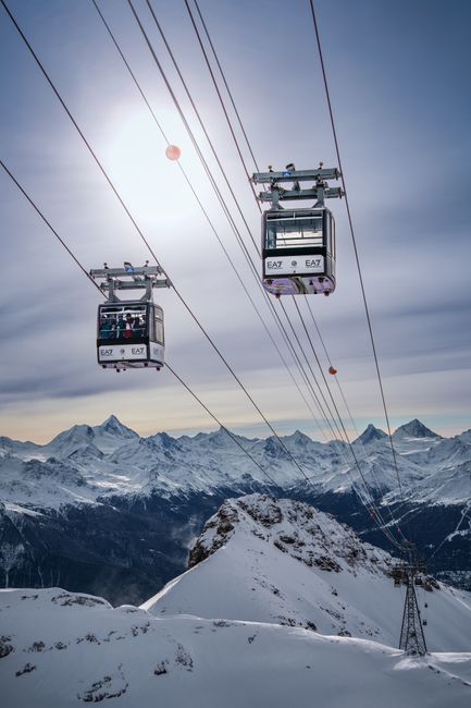 Beautiful snowy mountain scene with cable cars at Crans-Montana ski resort, Switzerland.