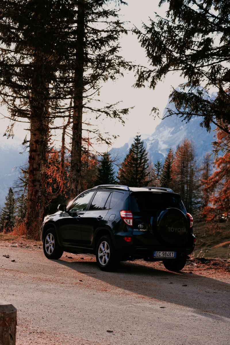 Black SUV on mountain road