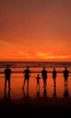 Silhouettes of People Standing at a Beach