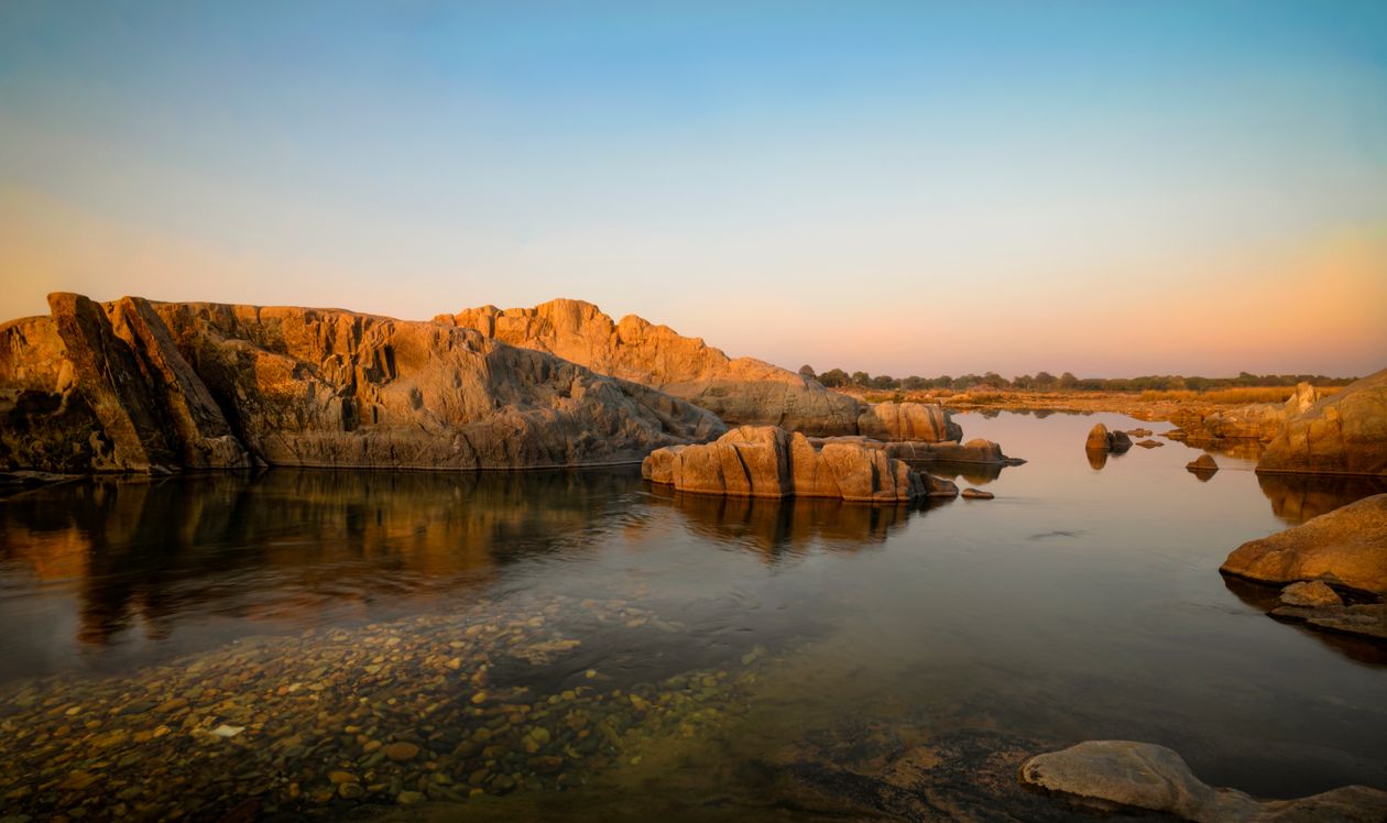 Natural Formations Rivers Rock Formations in River at Dawn · Free Stock Photo