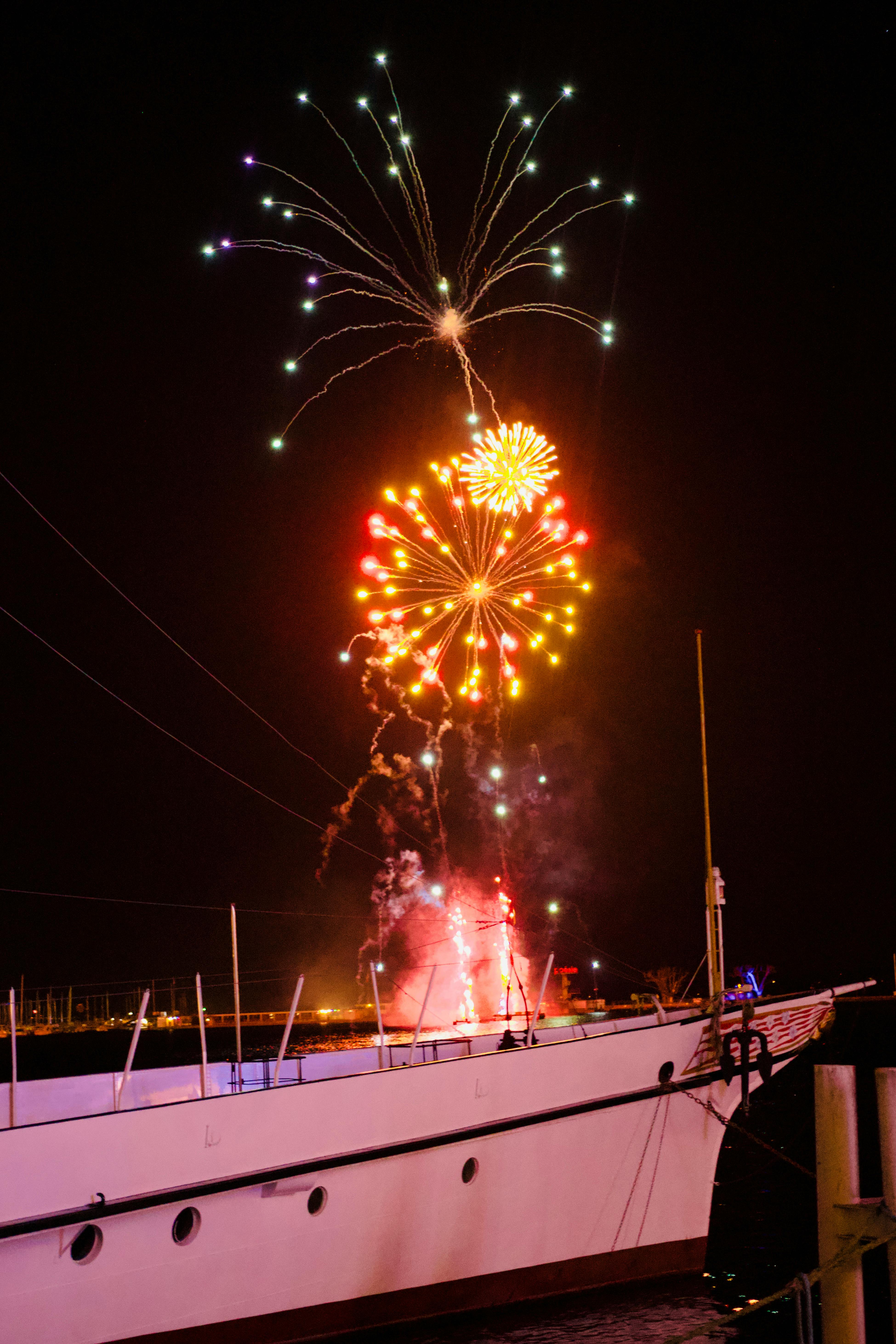 A fireworks display at night free stock photo