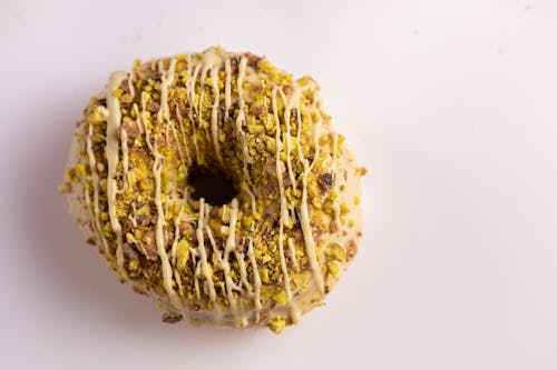 Donut with pistachio with white background