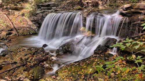 Downstream Waterfall on Black Rocks during Day