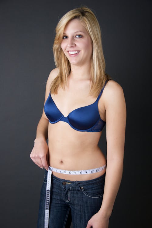 Blonde with Measuring Tape around her Belly