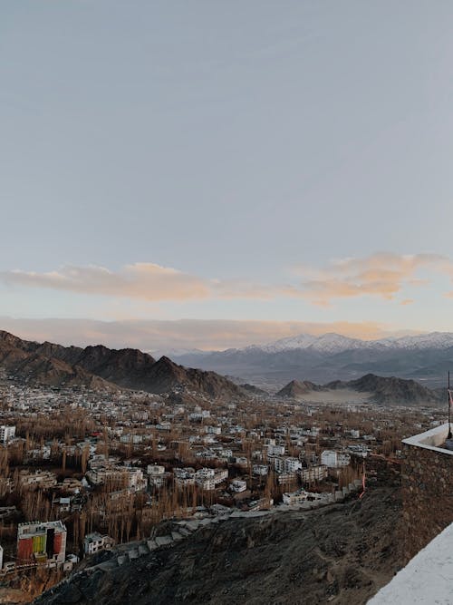 City in Mountains at Dawn
